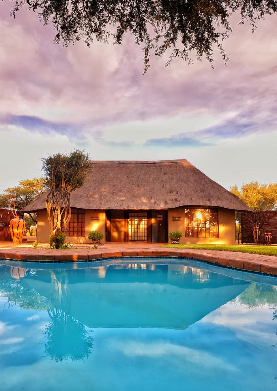 Thatched chalet beside the lodge pool